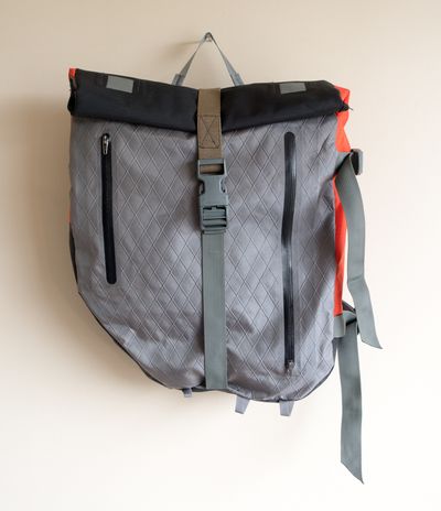 A slim but extensible pack for overnighters with pannier racks