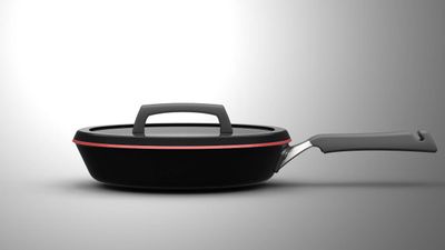 The ceramic non-stick coating extends to the outter lip of the stamp-formed pan body