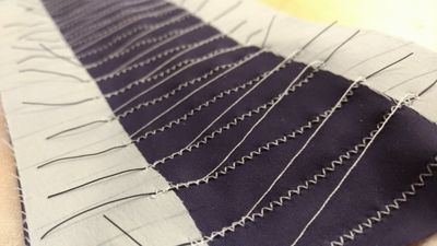 Array of sensors embroidered to on a stretch panel